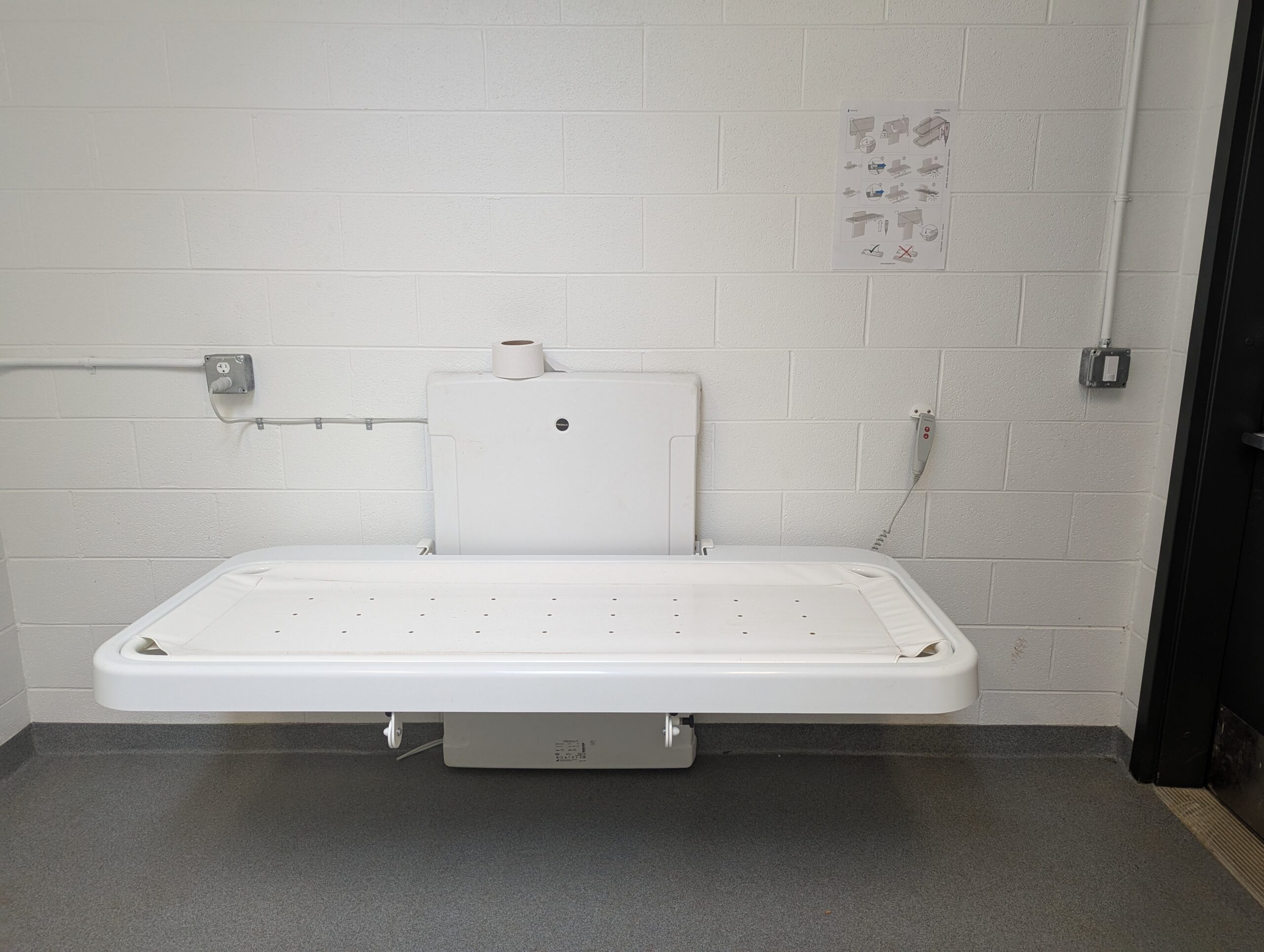 The adult changing table mounted into the wall at Pen Park