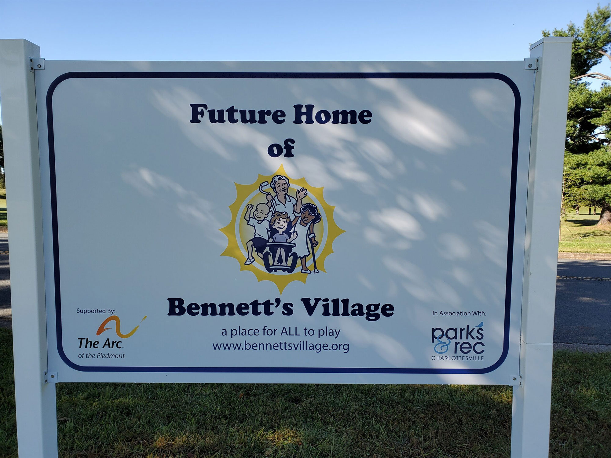 A sign saying "future home of Bennett's Village" with the former logo